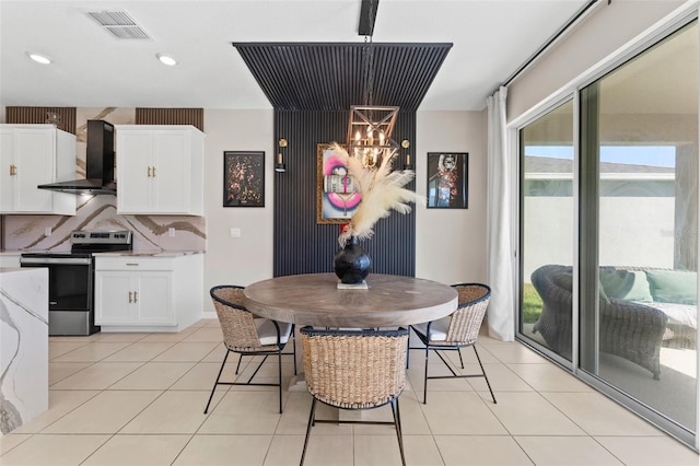 dining space with light tile patterned floors, recessed lighting, and visible vents