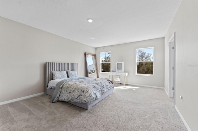 bedroom with carpet and baseboards