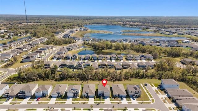 bird's eye view featuring a residential view and a water view