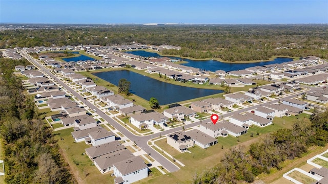 aerial view with a residential view and a water view