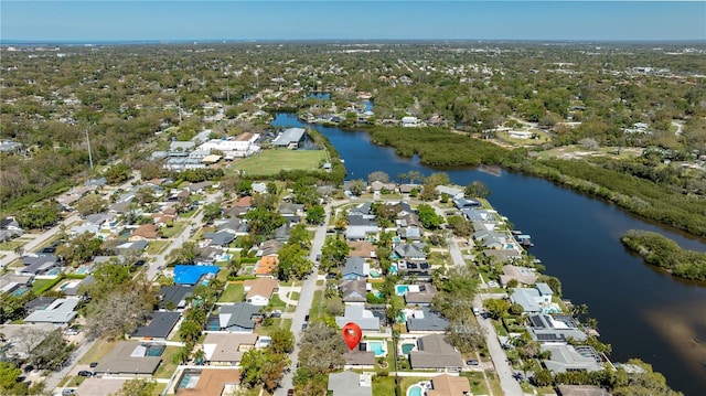 bird's eye view with a residential view and a water view