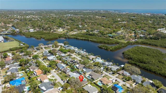 birds eye view of property with a residential view and a water view