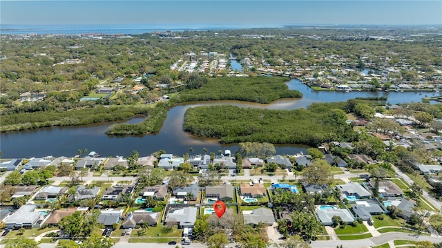 drone / aerial view with a water view and a residential view