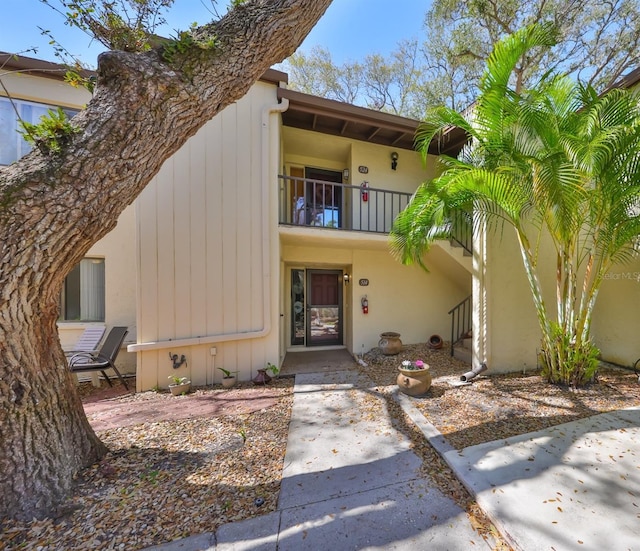 view of front of home with a balcony