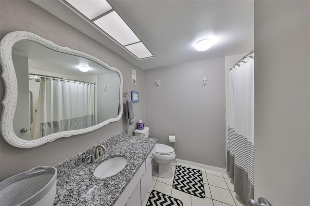 full bathroom featuring vanity, baseboards, curtained shower, tile patterned floors, and toilet