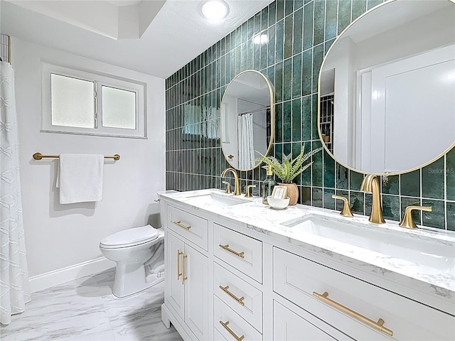 full bathroom featuring toilet, tile walls, and a sink