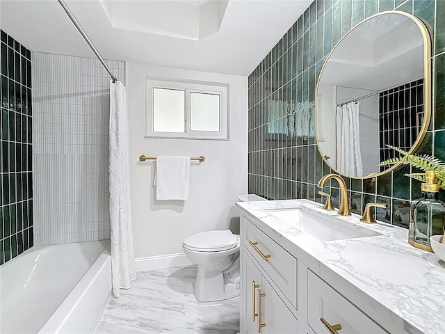 full bath with toilet, marble finish floor, shower / tub combo, baseboards, and vanity