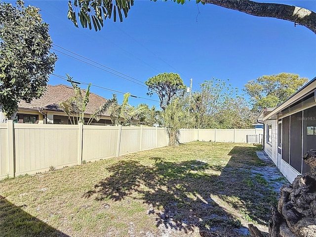 view of yard with a fenced backyard