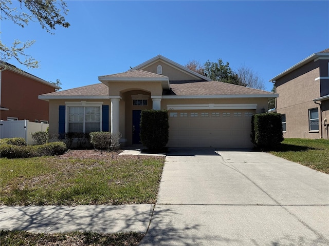 single story home featuring stucco siding, fence, concrete driveway, a shingled roof, and a garage