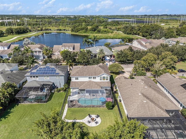 drone / aerial view featuring a residential view and a water view