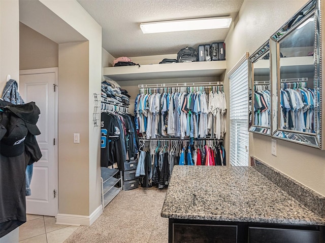 spacious closet with tile patterned floors