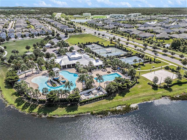 drone / aerial view with a residential view and a water view