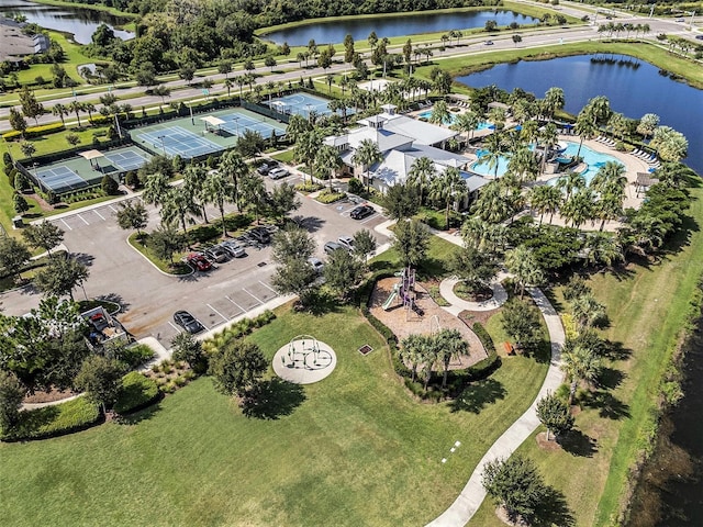 birds eye view of property with a water view