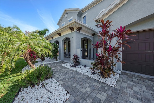 6617 Park Strand Dr, Apollo Beach, FL 33572 - view of side of home featuring stucco siding and a porch