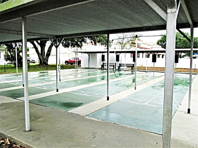 view of home's community featuring shuffleboard