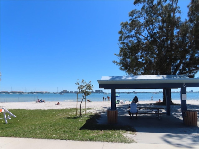 water view with a gazebo and a view of the beach