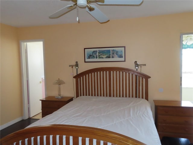 bedroom featuring baseboards and ceiling fan