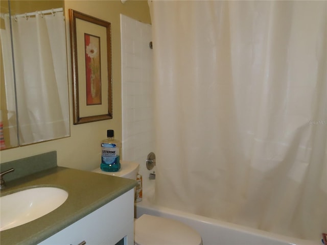 full bathroom featuring toilet, shower / bath combo, and vanity