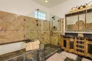 full bath featuring a shower stall