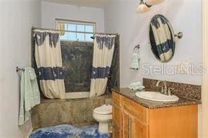 full bathroom with vanity, toilet, and shower / bathtub combination