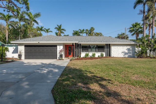 single story home featuring concrete driveway, a garage, roof with shingles, and a front lawn