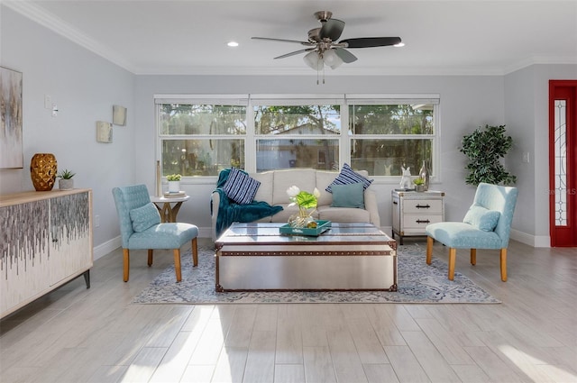 living room with a wealth of natural light, wood finished floors, and crown molding