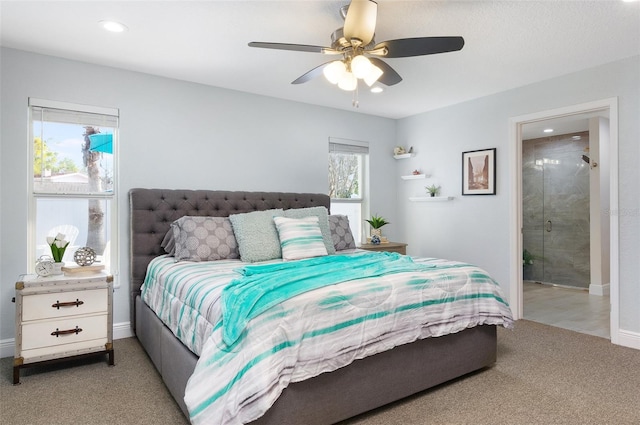 bedroom featuring connected bathroom, baseboards, light colored carpet, recessed lighting, and a ceiling fan