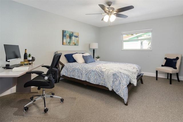 carpeted bedroom with baseboards and ceiling fan