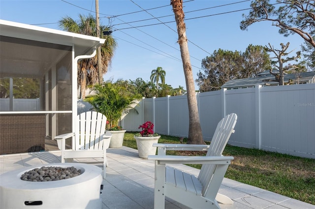 view of patio / terrace featuring a fenced backyard and an outdoor fire pit