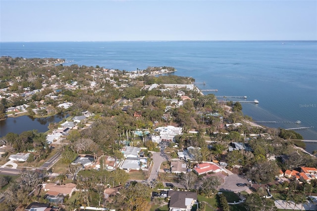 drone / aerial view with a residential view and a water view