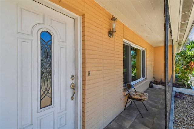 property entrance featuring a porch