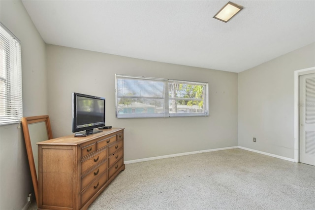 bedroom featuring baseboards