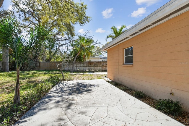 view of patio / terrace featuring fence