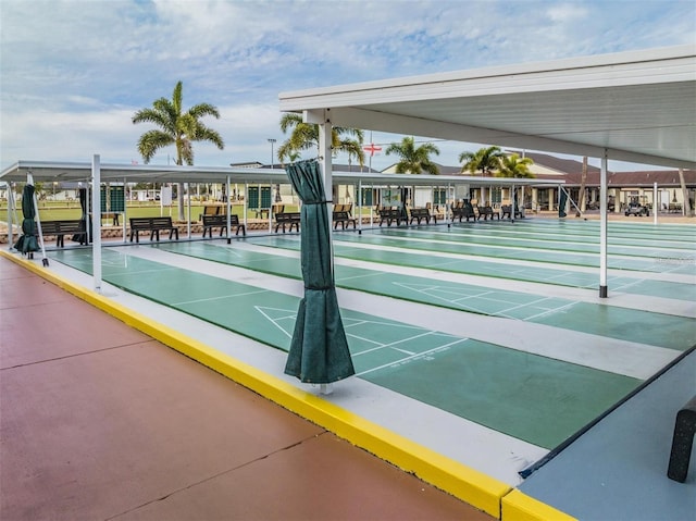 view of property's community featuring shuffleboard