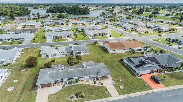 bird's eye view with a residential view and a water view