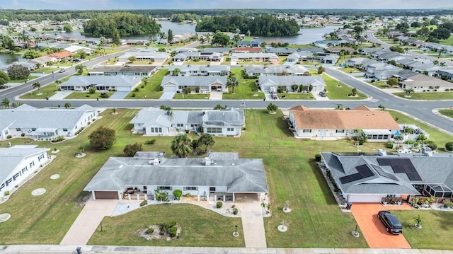 aerial view featuring a residential view and a water view