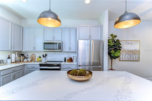 kitchen with recessed lighting, gray cabinets, appliances with stainless steel finishes, and pendant lighting