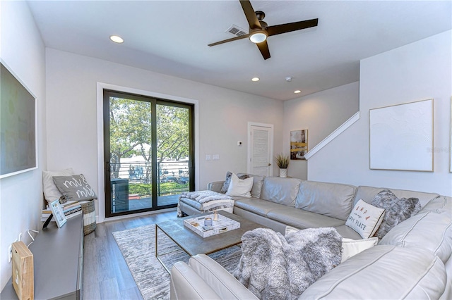 living room featuring a ceiling fan, recessed lighting, wood finished floors, and visible vents