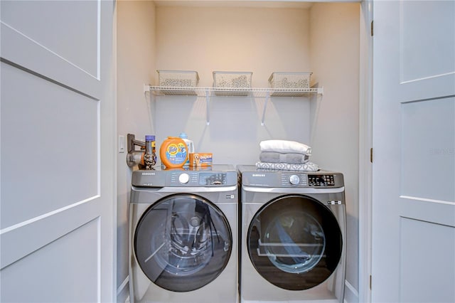 laundry area featuring laundry area and washer and clothes dryer