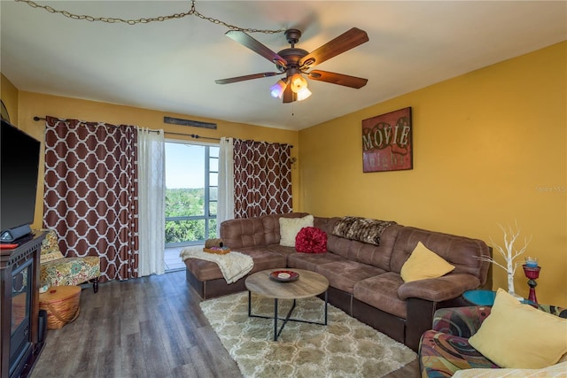 living area featuring wood finished floors and a ceiling fan