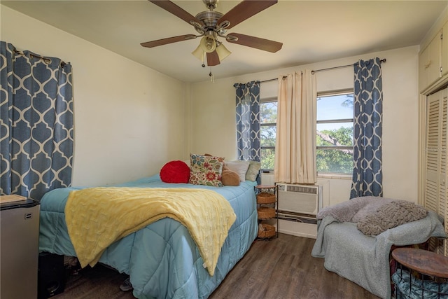 bedroom with a closet, a ceiling fan, and wood finished floors