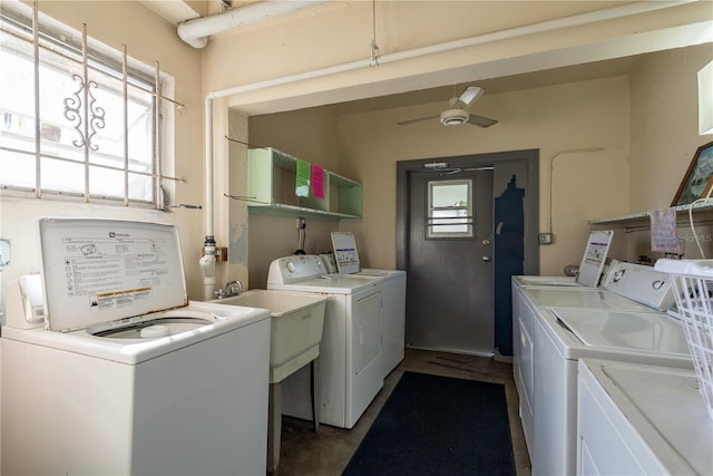 laundry room featuring a sink, ceiling fan, and washer and clothes dryer