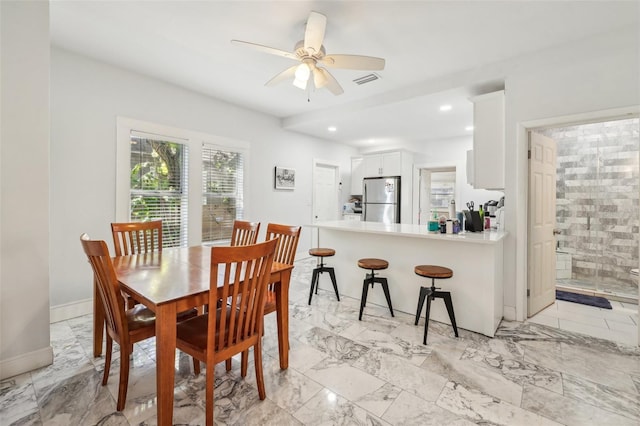 dining space with visible vents, marble finish floor, a ceiling fan, recessed lighting, and baseboards