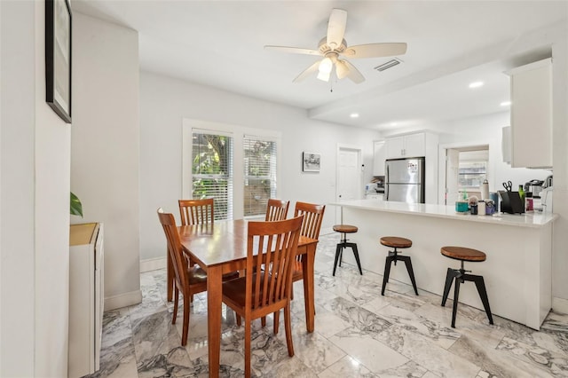 dining space featuring visible vents, baseboards, recessed lighting, marble finish floor, and a ceiling fan