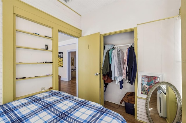 bedroom featuring a closet and wood finished floors