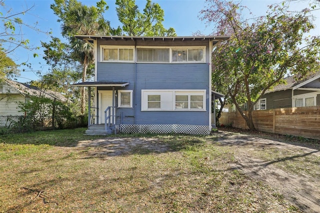 view of front of home with fence