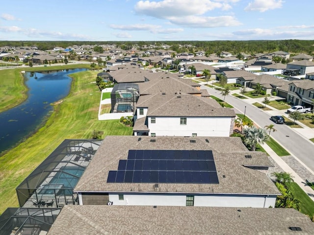 aerial view with a residential view and a water view