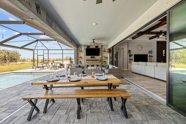 exterior space featuring a wealth of natural light and a ceiling fan