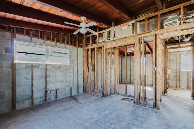 below grade area with ceiling fan