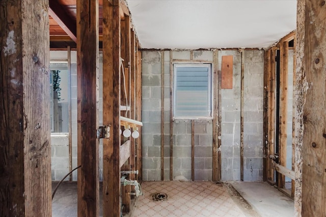 bathroom with concrete block wall